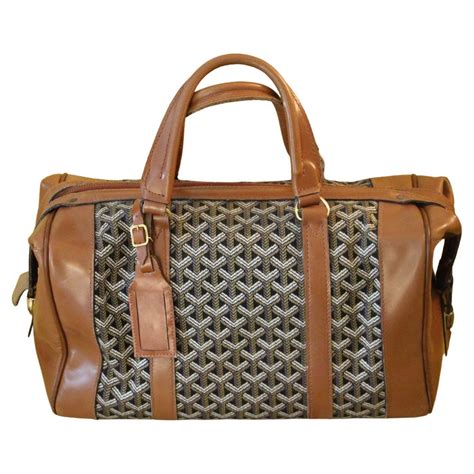 buy goyard duffle accessories.